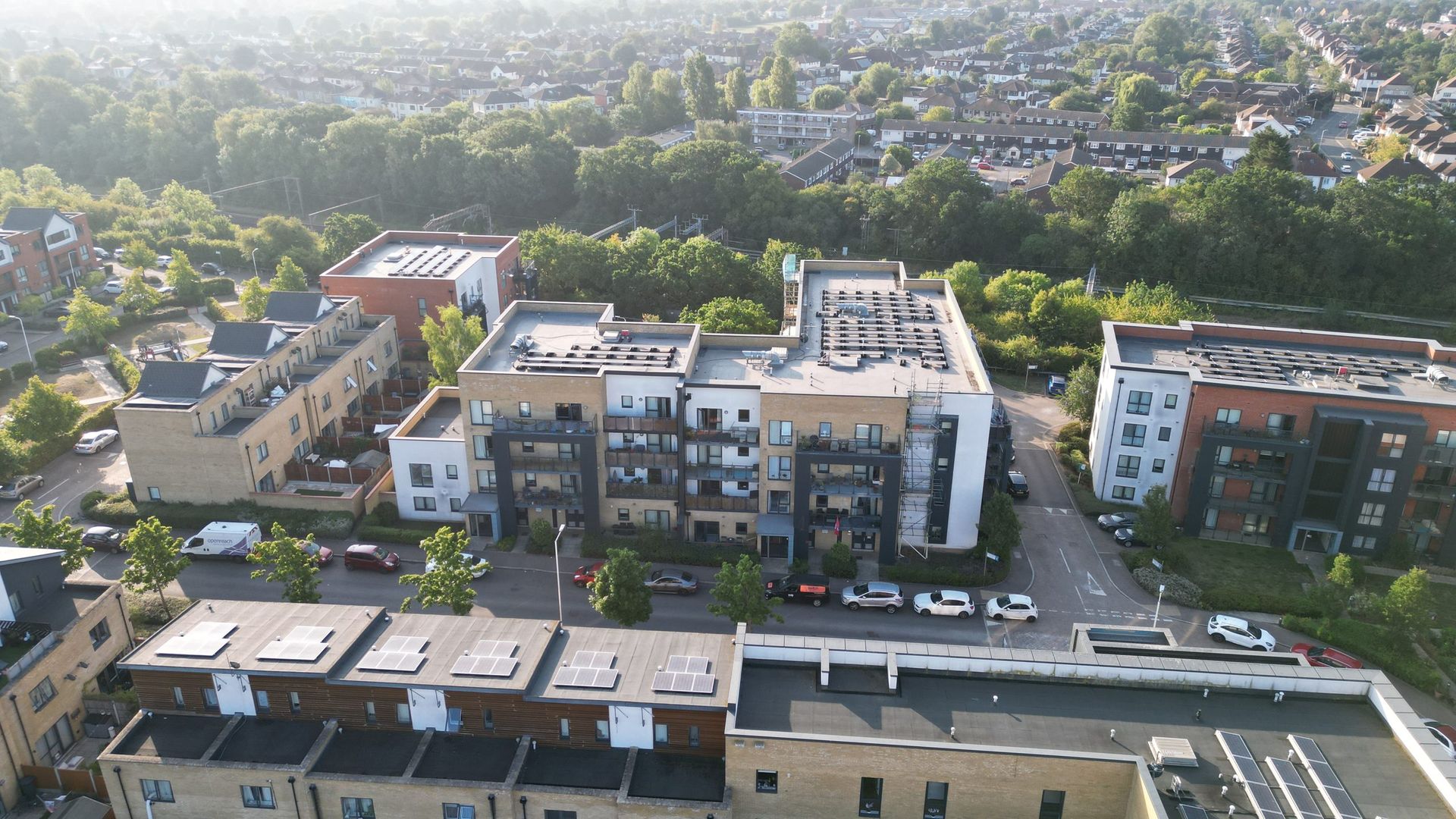 Residential development in Romford photographed from the air in evening light