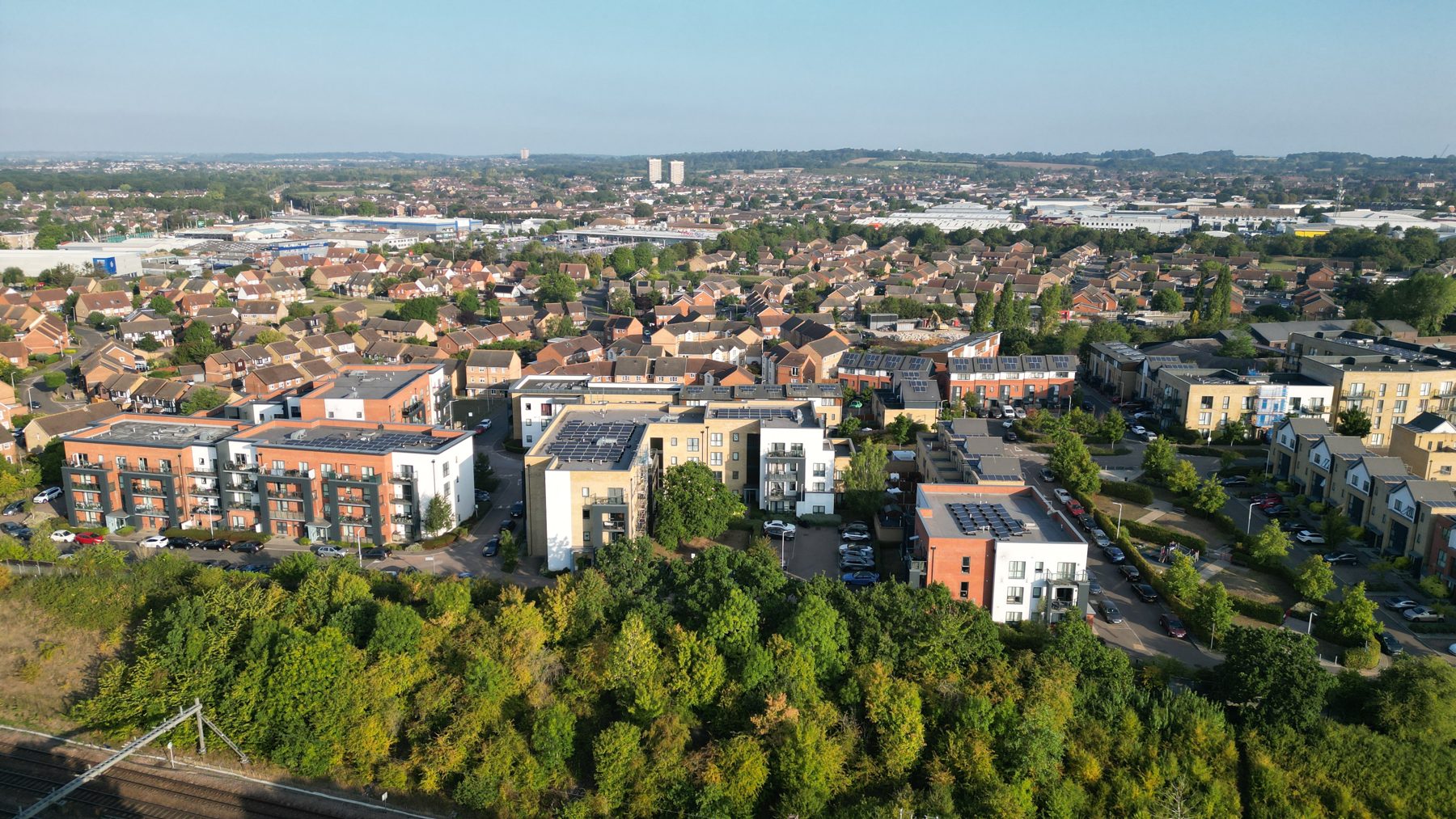 Rooftops photographed from the air over an Essex street