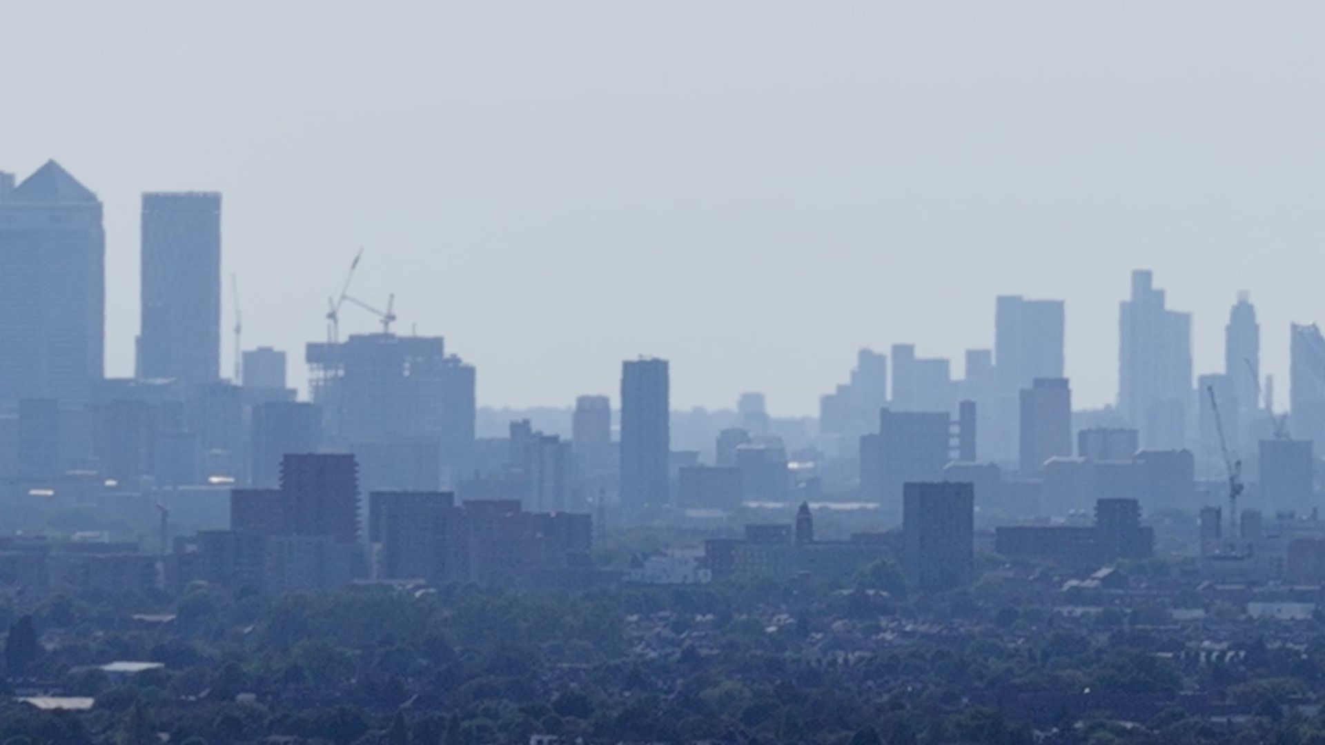 London skyline with Canary Wharf seen from east London at altitude