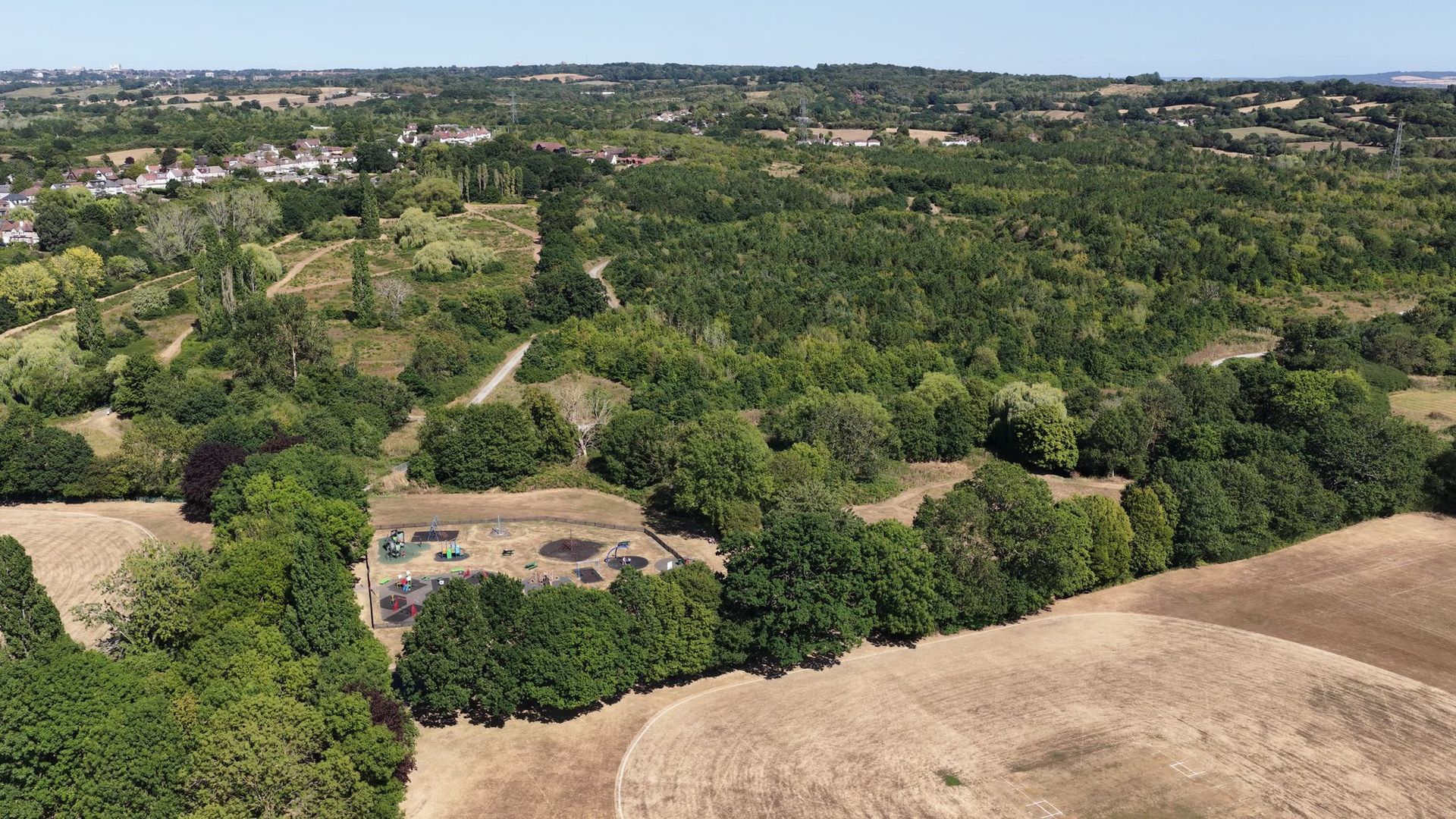 Parkland and open ground on the edge of London from the air
