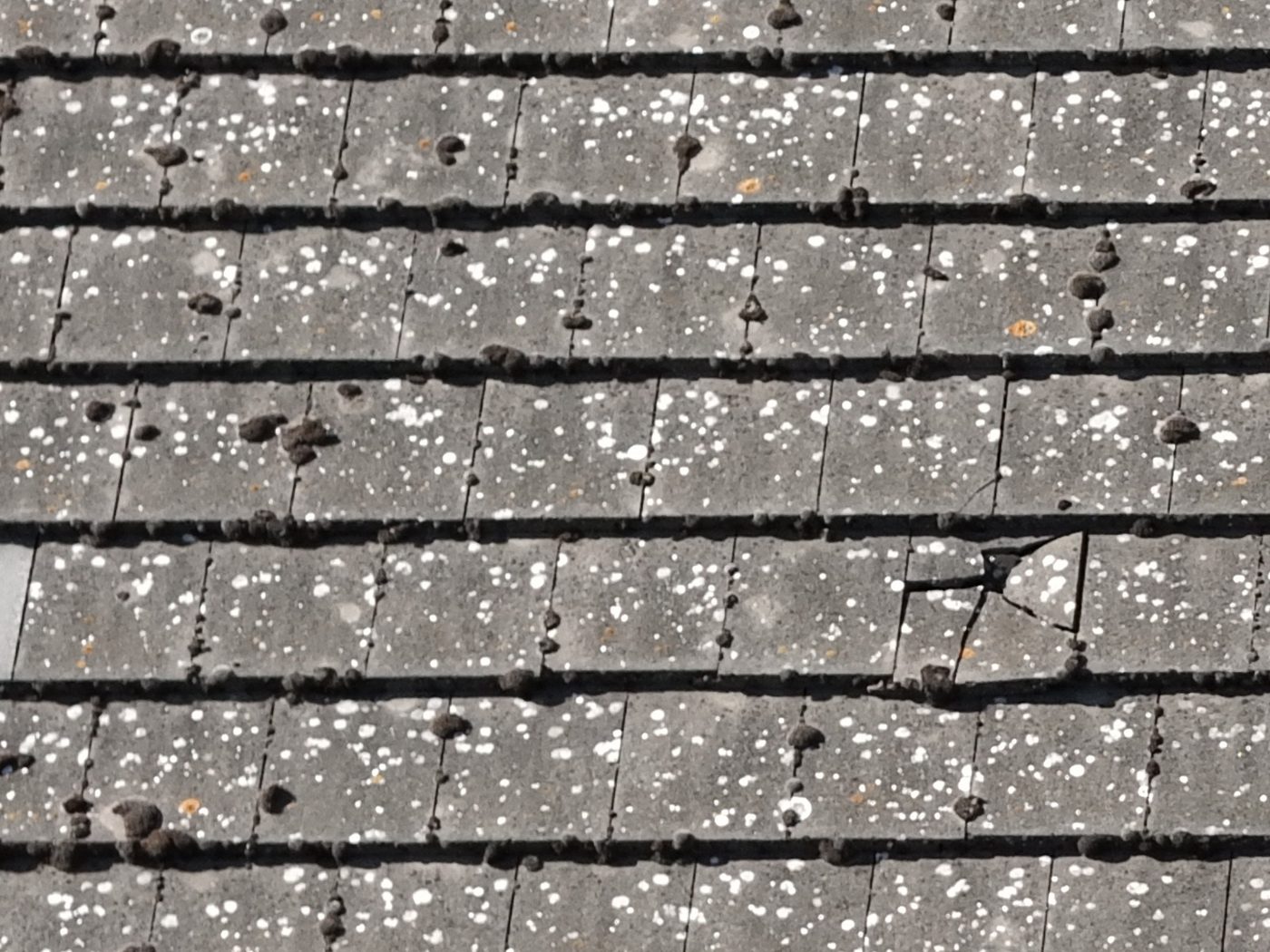 Cracked roof tile seen from a drone
